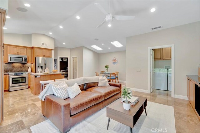 1806 Lake St, Huntington Beach, CA 92648 - living area with washing machine and clothes dryer, lofted ceiling, ceiling fan, recessed lighting, and baseboards
