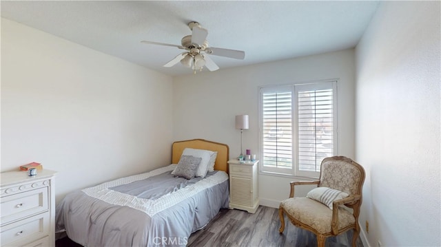 8776 Holly St, Rancho Cucamonga, CA 91701 - bedroom featuring light wood-type flooring, multiple windows, baseboards, and ceiling fan