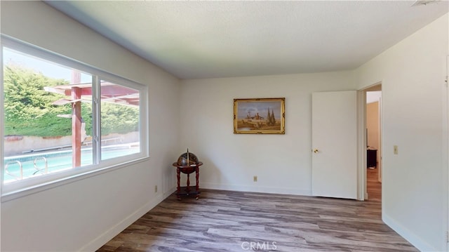 8776 Holly St, Rancho Cucamonga, CA 91701 - spare room with wood finished floors and baseboards