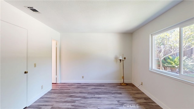 8776 Holly St, Rancho Cucamonga, CA 91701 - spare room with wood finished floors and baseboards
