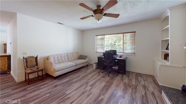 8776 Holly St, Rancho Cucamonga, CA 91701 - office space with ceiling fan, wood finished floors, baseboards, and a textured ceiling
