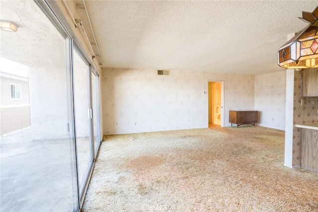 2468 Mohawk St Unit 102, Pasadena, CA 91107 - unfurnished living room with carpet flooring and a textured ceiling