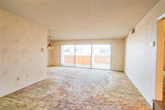 2468 Mohawk St Unit 102, Pasadena, CA 91107 - unfurnished room featuring a textured ceiling, wallpapered walls, and carpet