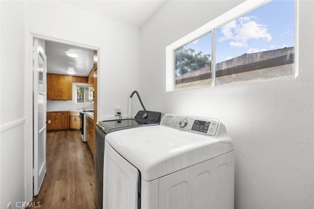 6031 Beck Ave, North Hollywood, CA 91606 - washroom with washing machine and clothes dryer and wood finished floors