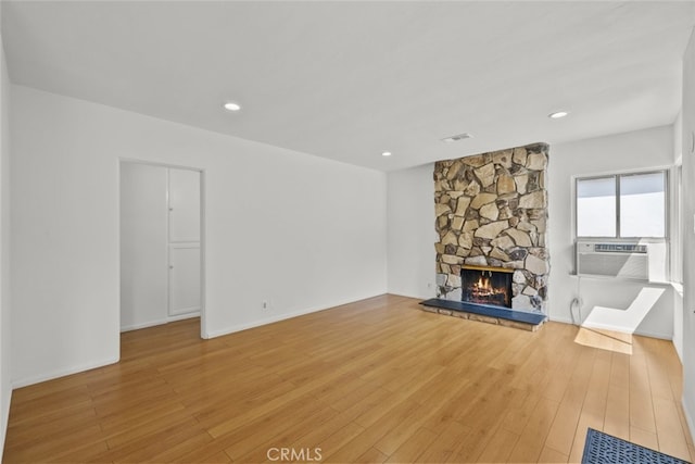 6031 Beck Ave, North Hollywood, CA 91606 - unfurnished living room featuring cooling unit, a fireplace, light wood-style floors, recessed lighting, and baseboards