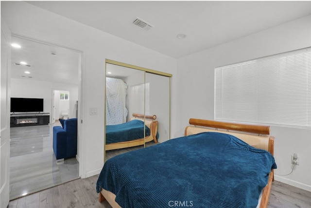 6031 Beck Ave, North Hollywood, CA 91606 - bedroom featuring wood finished floors, a closet, and baseboards
