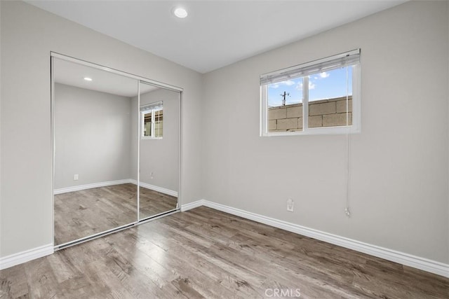 13339 Bonanza St, Arleta, CA 91331 - unfurnished bedroom featuring wood finished floors, baseboards, a closet, and recessed lighting