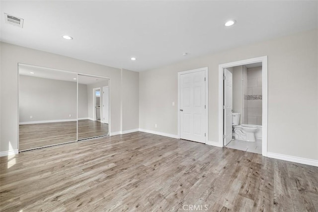 13339 Bonanza St, Arleta, CA 91331 - unfurnished bedroom with wood finished floors, a closet, recessed lighting, baseboards, and ensuite bath