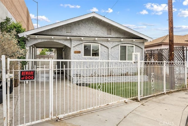 13339 Bonanza St, Arleta, CA 91331 - view of front of home featuring stucco siding, a fenced front yard, and a gate