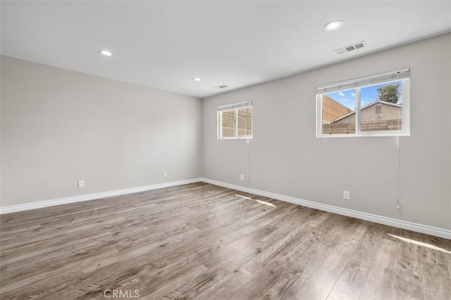 13339 Bonanza St, Arleta, CA 91331 - empty room featuring wood finished floors, plenty of natural light, baseboards, and recessed lighting