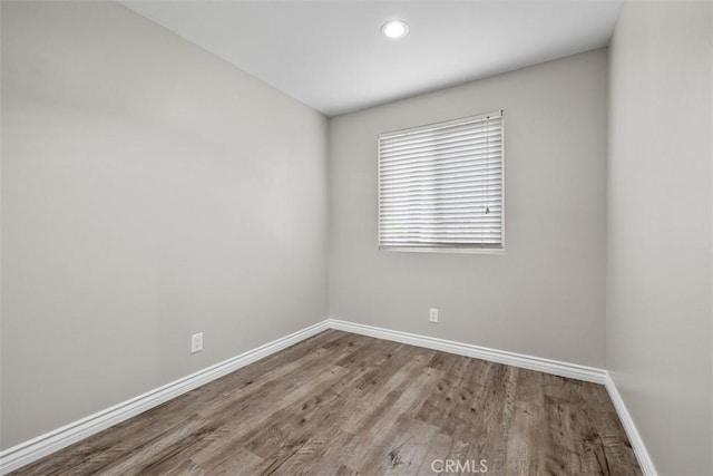 13339 Bonanza St, Arleta, CA 91331 - spare room featuring baseboards, wood finished floors, and recessed lighting