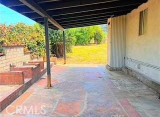7111 Colwyn Ave, Highland, CA 92346 - view of patio with an attached carport