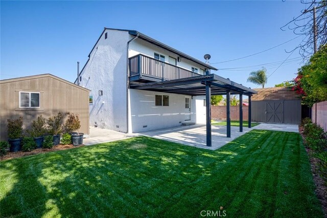 11091 Ranger Dr, Los Alamitos, CA 90720 - back of property with a patio area, a balcony, and stucco siding