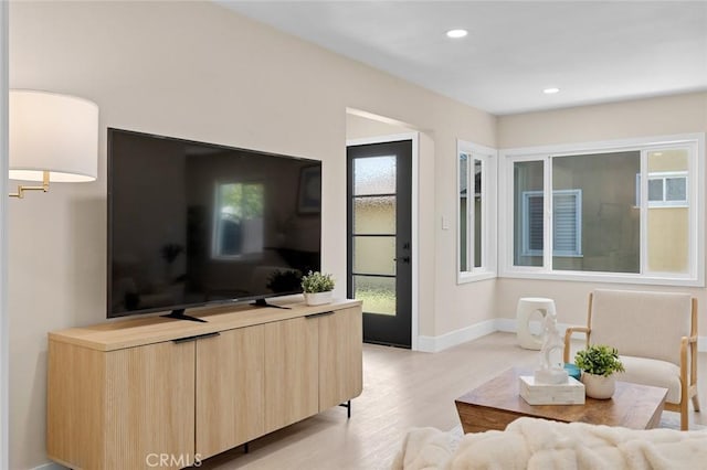 11091 Ranger Dr, Los Alamitos, CA 90720 - living room with light wood-type flooring, baseboards, and recessed lighting