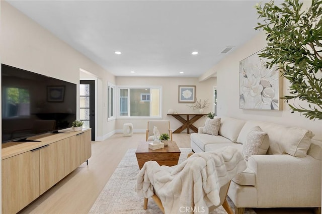 11091 Ranger Dr, Los Alamitos, CA 90720 - living room with light wood finished floors and recessed lighting