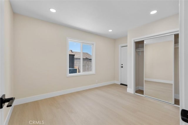 11091 Ranger Dr, Los Alamitos, CA 90720 - unfurnished bedroom with wood finished floors, a closet, baseboards, and recessed lighting