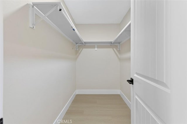 11091 Ranger Dr, Los Alamitos, CA 90720 - walk in closet featuring light wood-type flooring