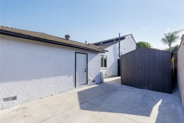 11091 Ranger Dr, Los Alamitos, CA 90720 - view of side of property featuring a patio area and stucco siding