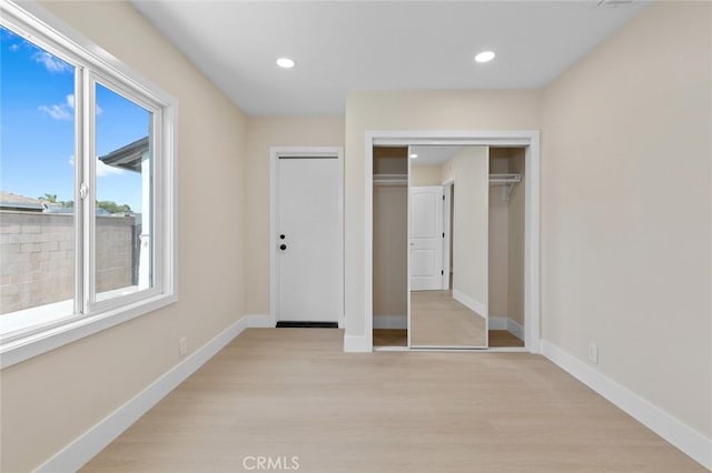 11091 Ranger Dr, Los Alamitos, CA 90720 - unfurnished bedroom with light wood finished floors, recessed lighting, and baseboards