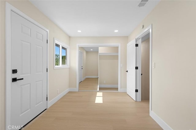 11091 Ranger Dr, Los Alamitos, CA 90720 - corridor with light wood-style floors, baseboards, and recessed lighting