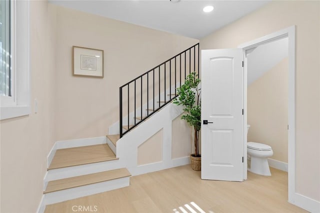11091 Ranger Dr, Los Alamitos, CA 90720 - stairway featuring wood finished floors, baseboards, and recessed lighting
