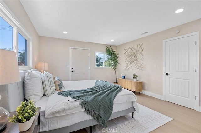 11091 Ranger Dr, Los Alamitos, CA 90720 - bedroom with light wood-type flooring, recessed lighting, and baseboards