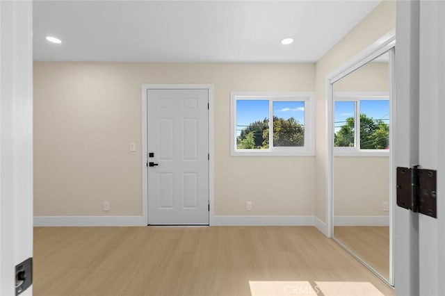 11091 Ranger Dr, Los Alamitos, CA 90720 - foyer entrance with light wood finished floors, baseboards, and recessed lighting