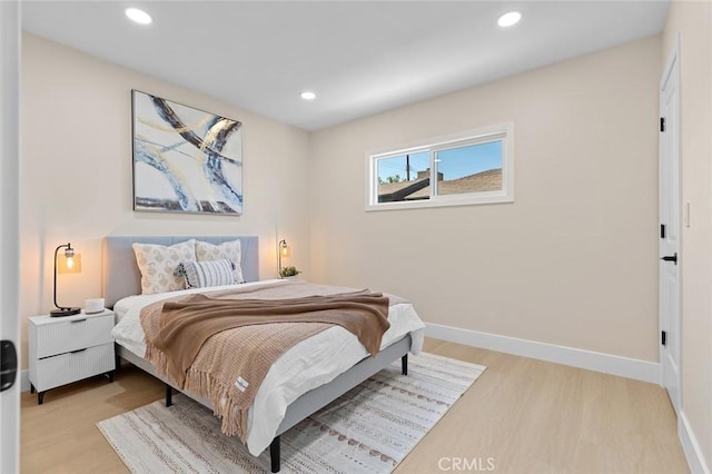 11091 Ranger Dr, Los Alamitos, CA 90720 - bedroom with wood finished floors, baseboards, and recessed lighting