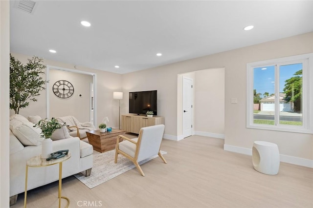 11091 Ranger Dr, Los Alamitos, CA 90720 - living area featuring light wood-type flooring, baseboards, and recessed lighting