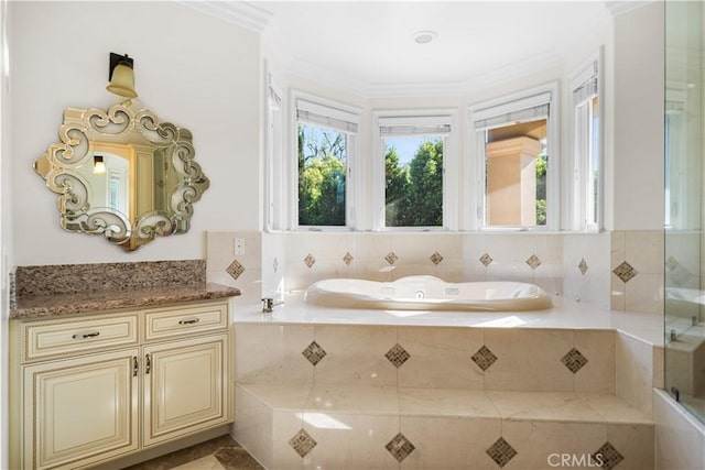 553 Woodward Blvd, Pasadena, CA 91107 - bathroom featuring a garden tub, plenty of natural light, vanity, and ornamental molding