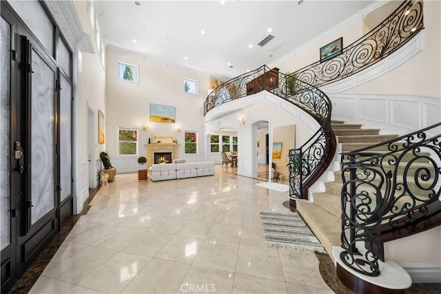 553 Woodward Blvd, Pasadena, CA 91107 - entrance foyer with a high ceiling, healthy amount of natural light, stairway, french doors, and a decorative wall