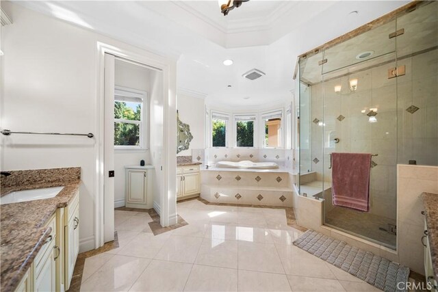 553 Woodward Blvd, Pasadena, CA 91107 - bathroom with ornamental molding, a garden tub, vanity, a shower stall, and inlaid floor details