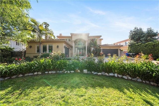 553 Woodward Blvd, Pasadena, CA 91107 - mediterranean / spanish-style home with stucco siding, a front lawn, a garage, a chimney, and a tile roof