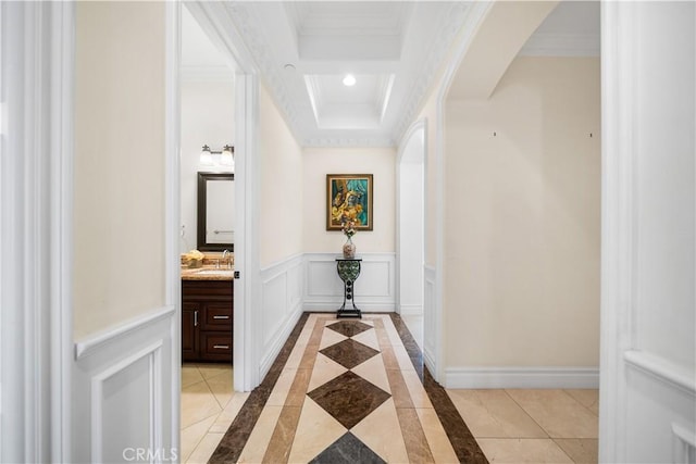 553 Woodward Blvd, Pasadena, CA 91107 - hall featuring arched walkways, a sink, a raised ceiling, ornamental molding, and a decorative wall