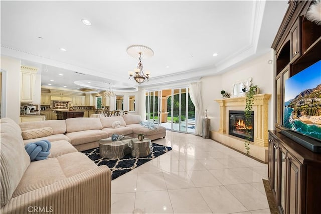 553 Woodward Blvd, Pasadena, CA 91107 - living area with a tray ceiling, a chandelier, a fireplace, light tile patterned flooring, and ornamental molding