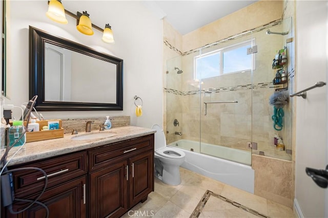 553 Woodward Blvd, Pasadena, CA 91107 - full bathroom featuring vanity, toilet, combined bath / shower with glass door, inlaid floor details, and tile patterned flooring