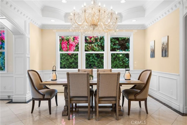 553 Woodward Blvd, Pasadena, CA 91107 - dining space with crown molding, a decorative wall, a chandelier, inlaid floor details, and light tile patterned floors