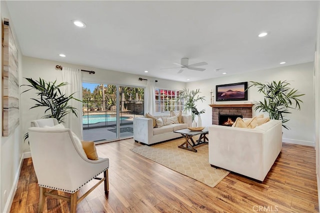 24851 Via Santa Cruz, Mission Viejo, CA 92692 - living area featuring a fireplace, ceiling fan, light wood finished floors, recessed lighting, and baseboards