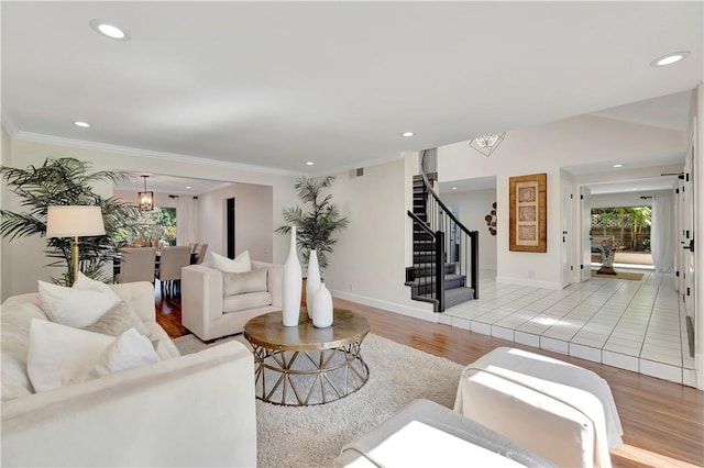 24851 Via Santa Cruz, Mission Viejo, CA 92692 - living area featuring stairs, light wood-style floors, recessed lighting, crown molding, and baseboards