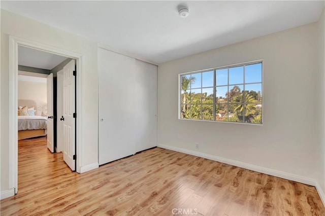 24851 Via Santa Cruz, Mission Viejo, CA 92692 - spare room with light wood-type flooring, baseboards, and a smoke detector