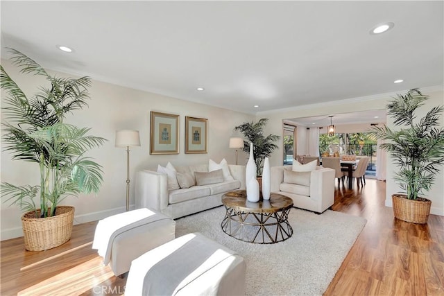 24851 Via Santa Cruz, Mission Viejo, CA 92692 - living room with light wood-style flooring, recessed lighting, ornamental molding, and baseboards