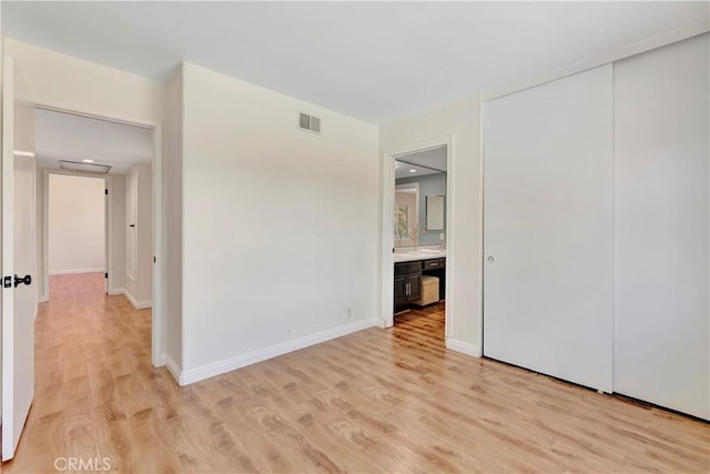 24851 Via Santa Cruz, Mission Viejo, CA 92692 - unfurnished bedroom featuring light wood finished floors, baseboards, and a closet