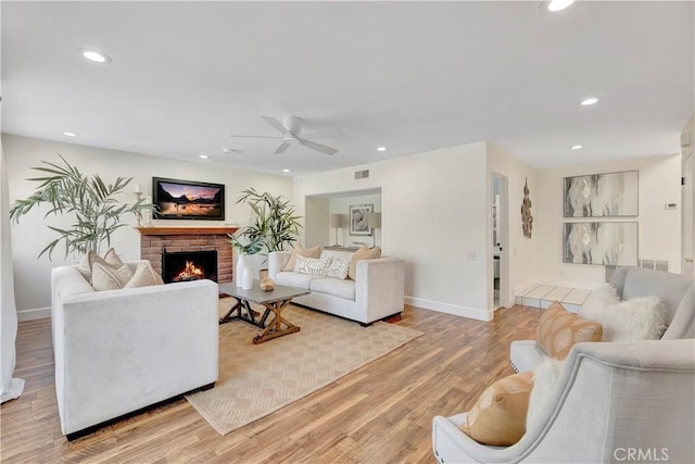 24851 Via Santa Cruz, Mission Viejo, CA 92692 - living room featuring a ceiling fan, recessed lighting, light wood finished floors, a fireplace, and baseboards
