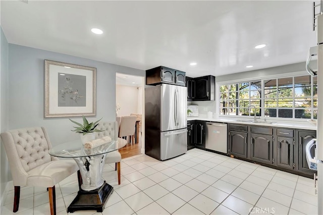 24851 Via Santa Cruz, Mission Viejo, CA 92692 - kitchen with appliances with stainless steel finishes, light countertops, a sink, recessed lighting, and light tile patterned flooring