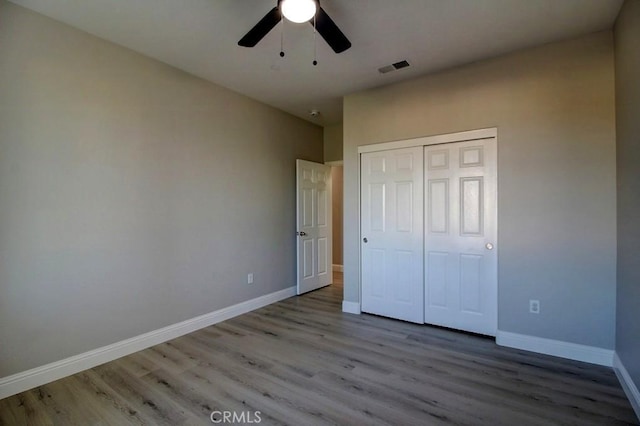 691 Pinot Blanc Ct, Los Banos, CA 93635 - unfurnished bedroom featuring wood finished floors, baseboards, a closet, and ceiling fan