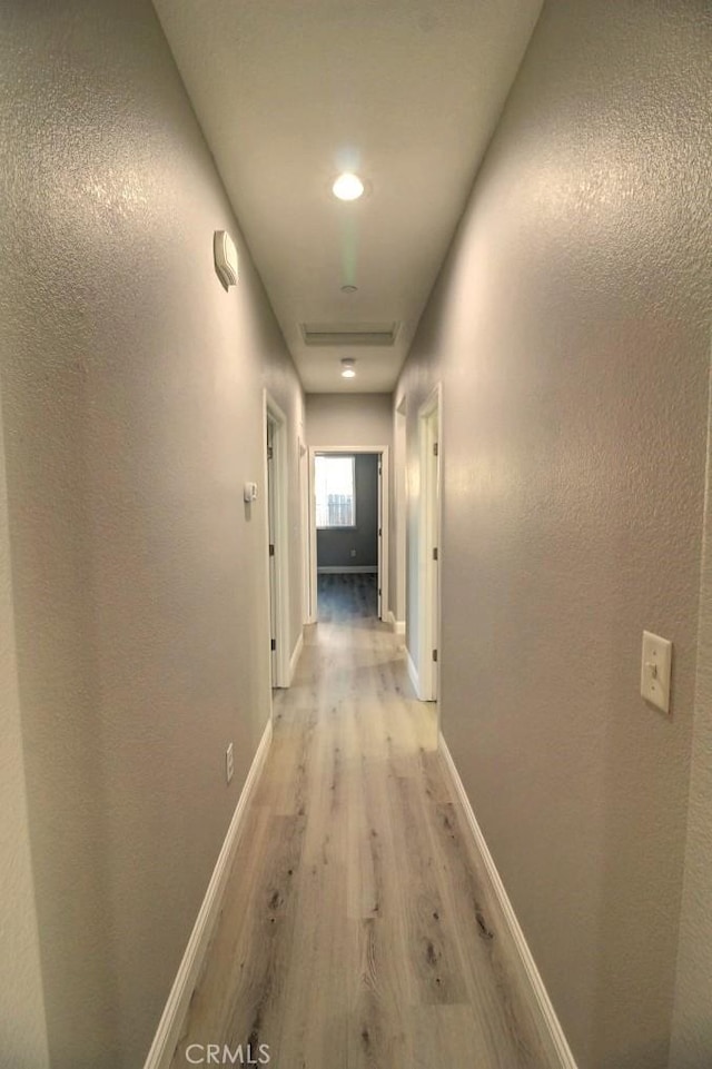 691 Pinot Blanc Ct, Los Banos, CA 93635 - corridor featuring light wood finished floors and baseboards
