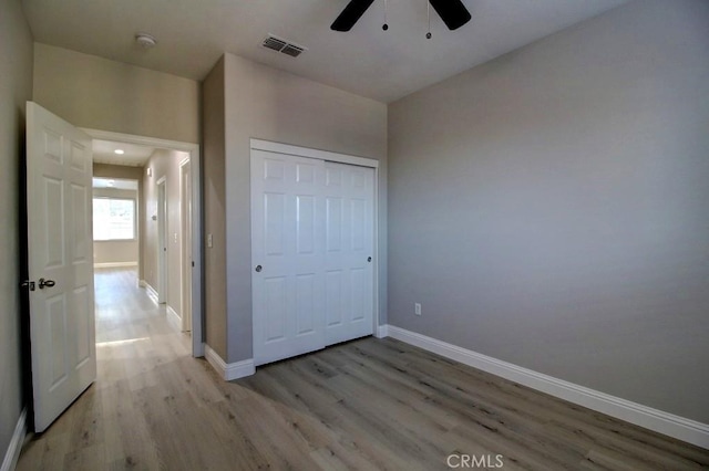 691 Pinot Blanc Ct, Los Banos, CA 93635 - unfurnished bedroom featuring light wood finished floors, baseboards, a closet, and a ceiling fan