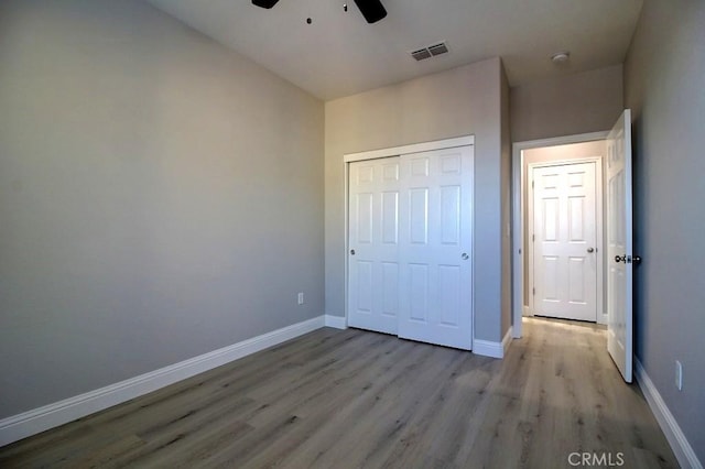 691 Pinot Blanc Ct, Los Banos, CA 93635 - unfurnished bedroom with wood finished floors, a closet, and baseboards