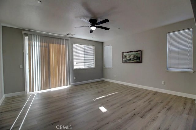 691 Pinot Blanc Ct, Los Banos, CA 93635 - unfurnished room with a ceiling fan, baseboards, and wood finished floors