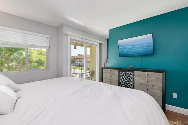 264 Espanas Gln, Escondido, CA 92026 - bedroom featuring access to exterior, wood finished floors, and baseboards
